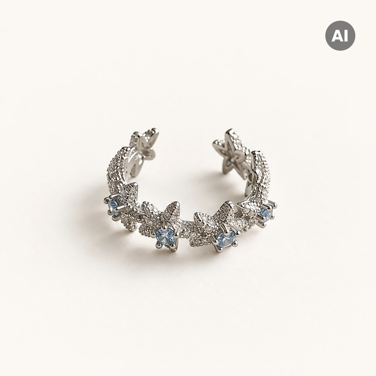 Ear Cuff mit Seesternen und blauem Besatz, silberfarben