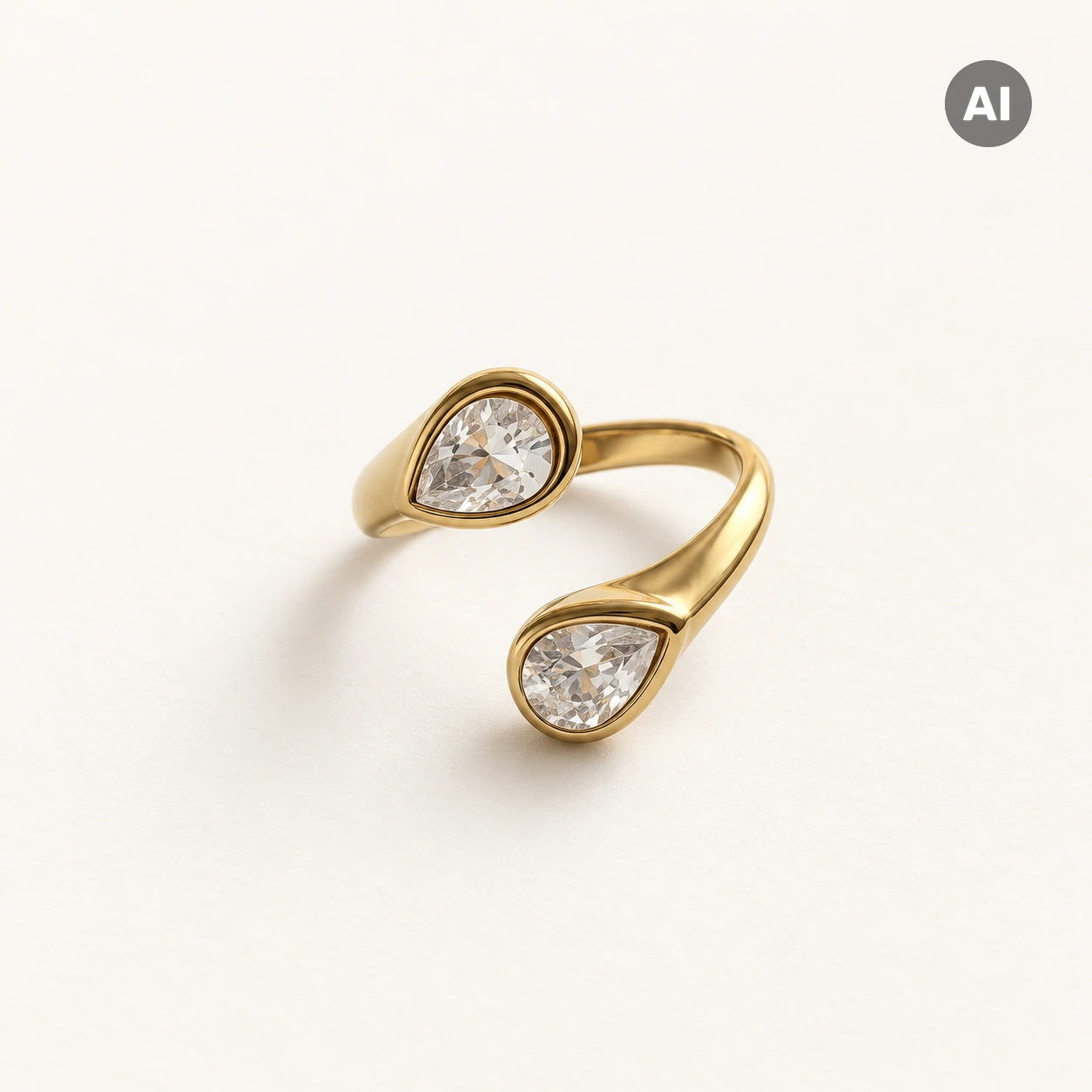 Ring mit offenem Profil und zwei Glassteinen in Tropfen-Zarge, goldfarben