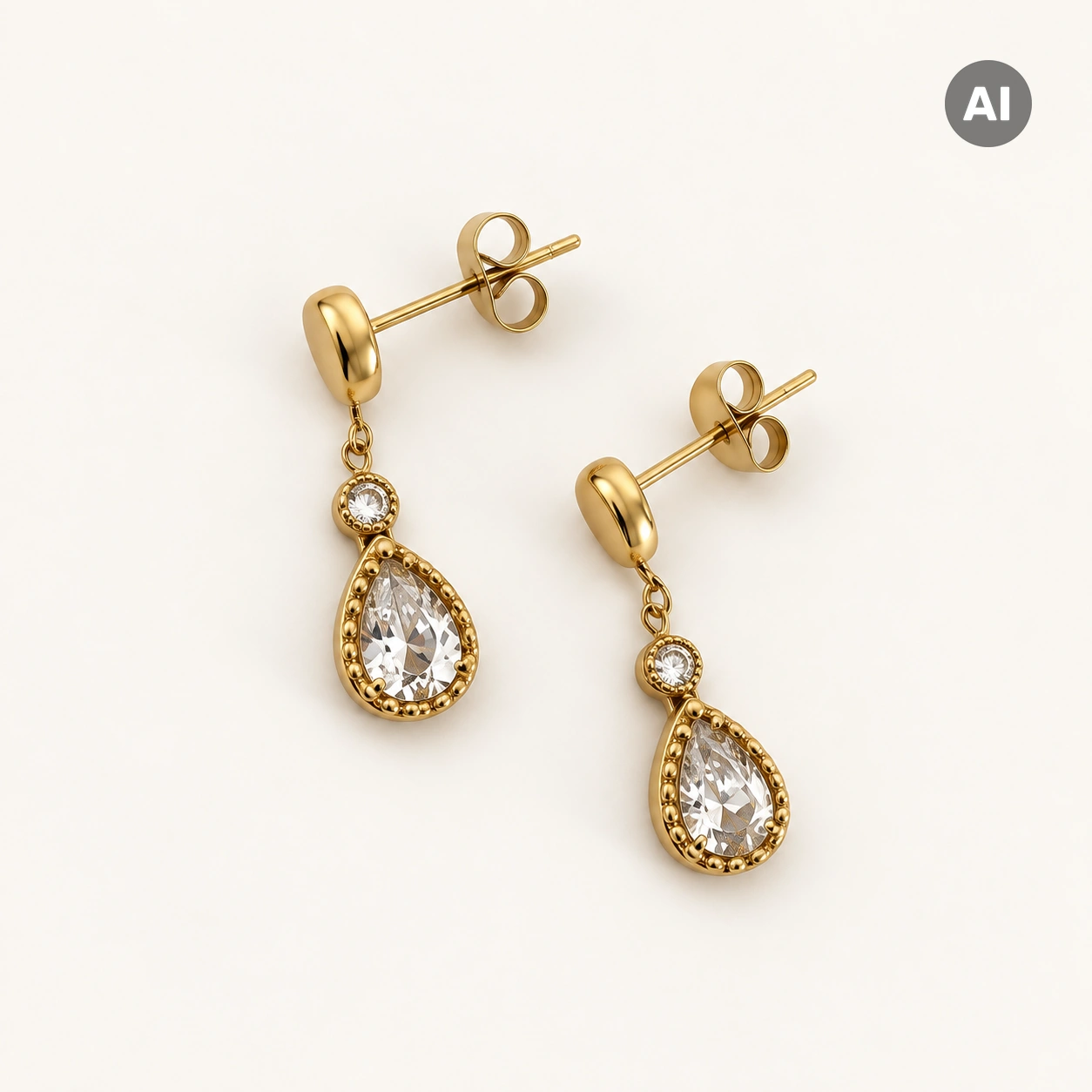 Ohrstecker mit Zirkonia und Tropfenanhänger mit Kugelrand, goldfarben