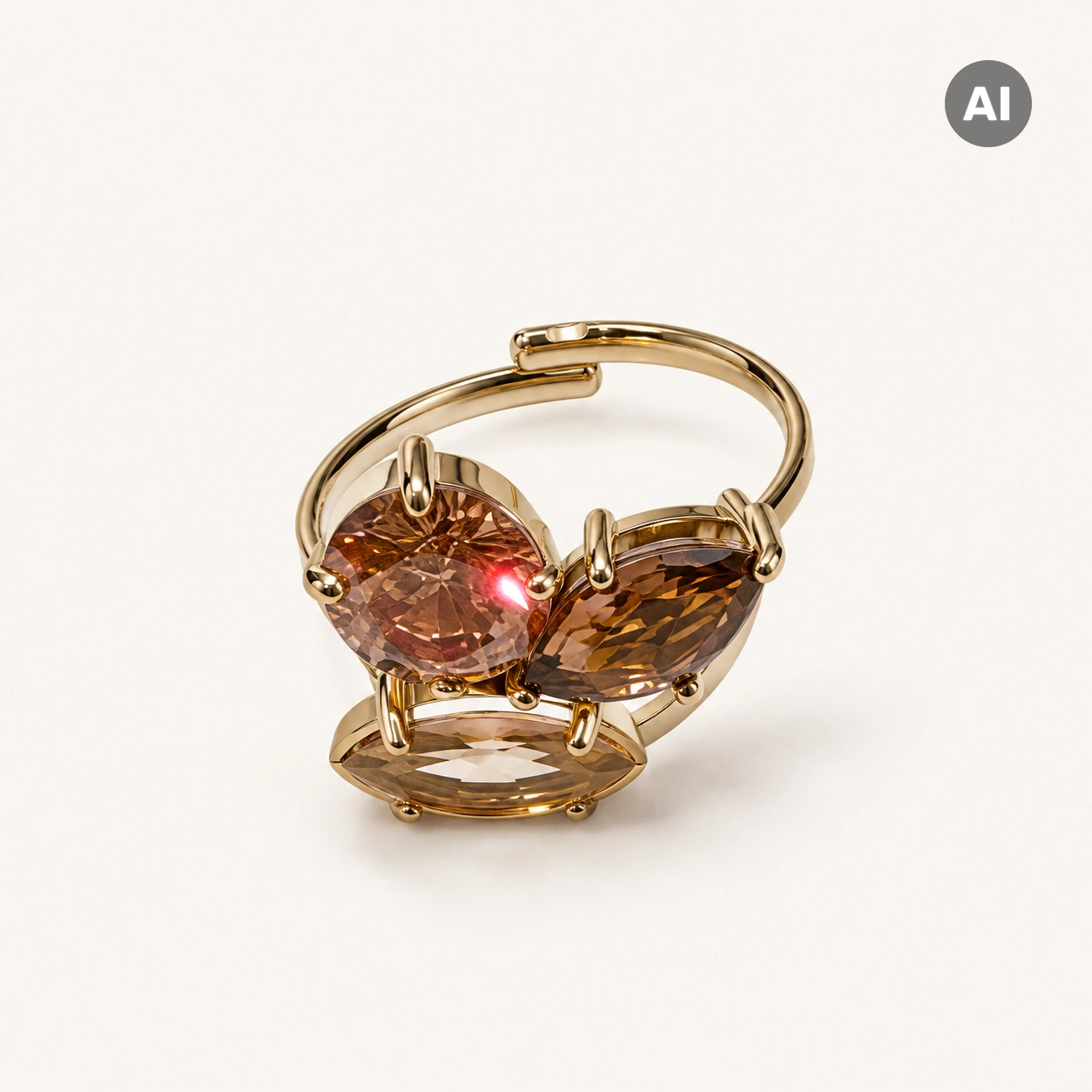 Ring mit offenem Profil und drei braunen Glassteinen, goldfarben