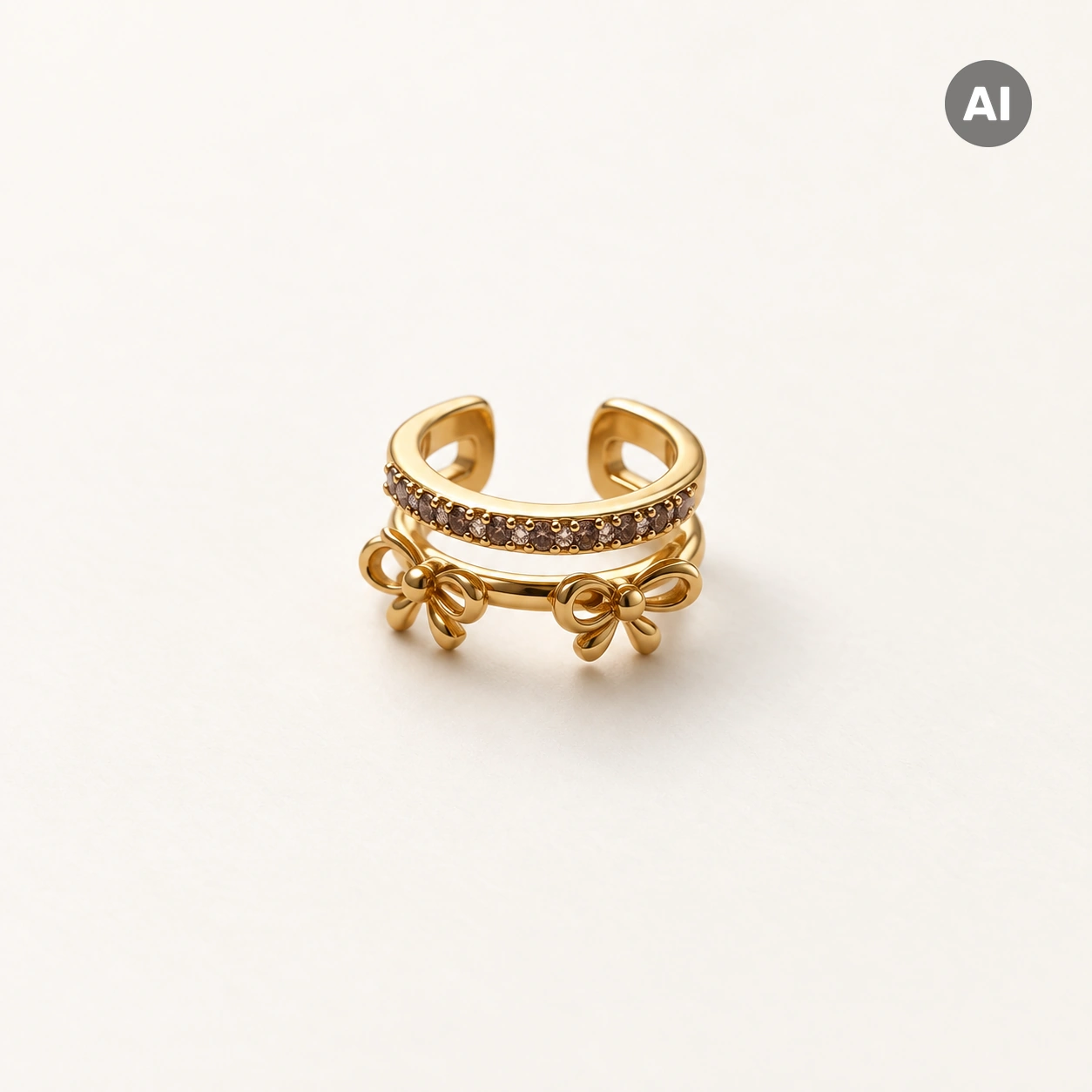 Ear Cuff mit zwei Schleifen und Besatz-Reihe, goldfarben