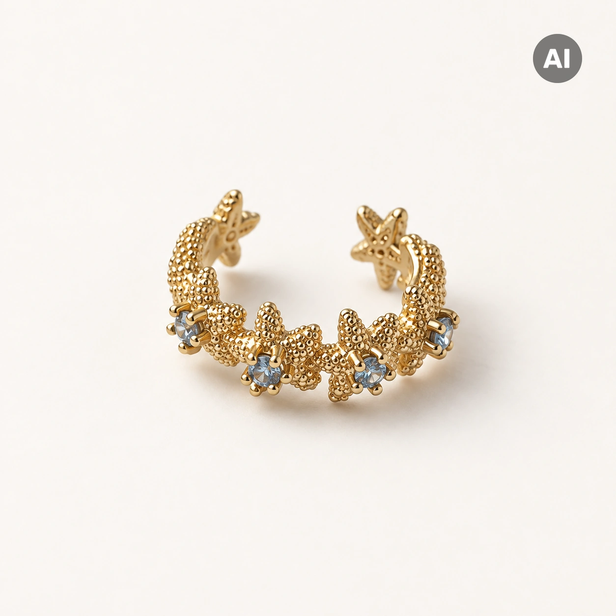 Ear Cuff mit Seesternen und blauem Besatz, goldfarben